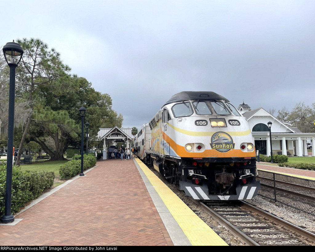 Northbound Sunrail Train # P316 has just discharged a large group of people getting off at Winter Park, Florida Station